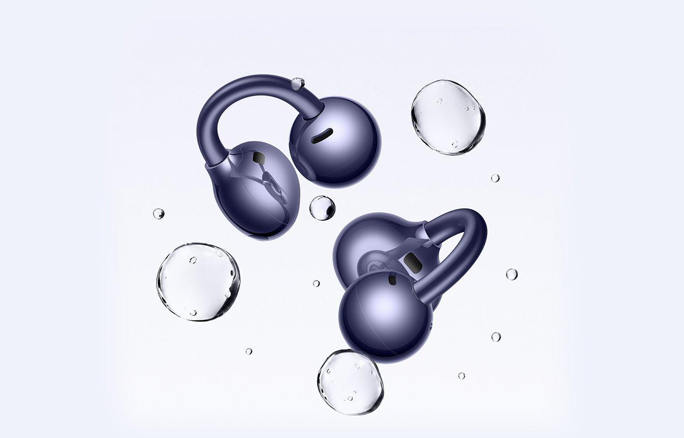 FreeClip 2 earbuds with water droplets indicating water resistance