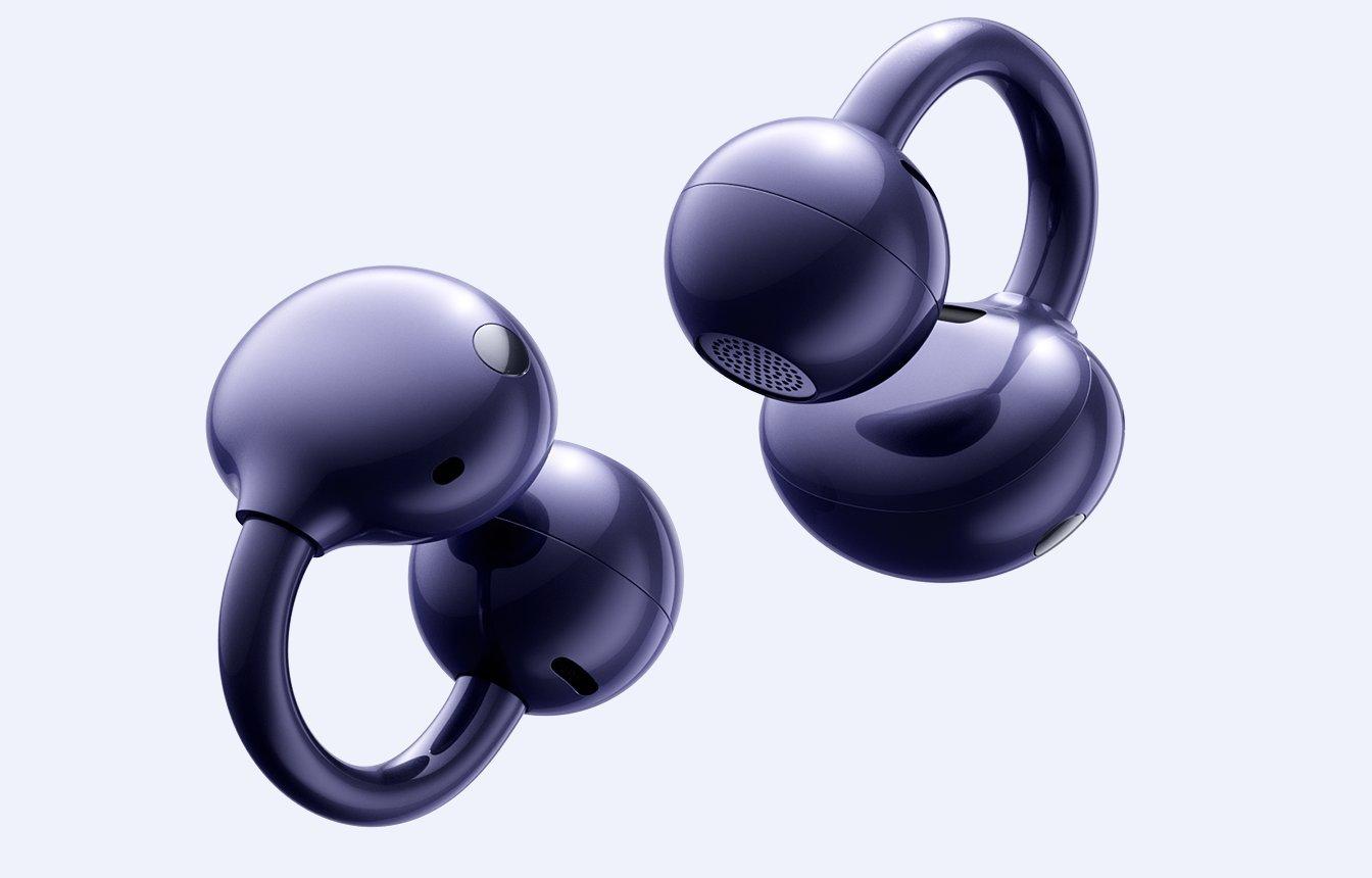 FreeClip 2 earbuds with water droplets indicating water resistance